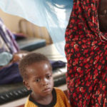 Oxfam_East_Africa_-_Luli_looks_after_her_severely_malnourished_child_Aden-730×550